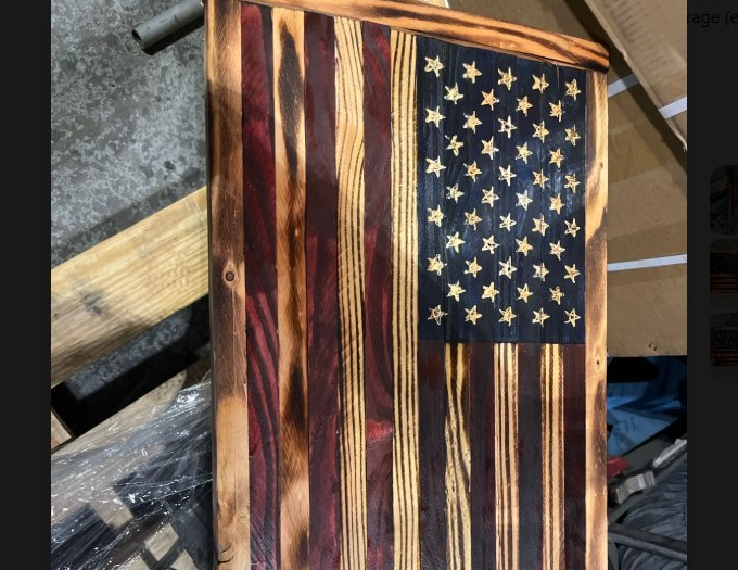 Vertical charred wooden flag with 50 stars